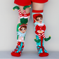 Colorful elf character socks featuring fun Christmas patterns and attached plush elves.
